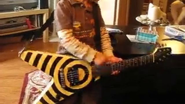 My munchkin nephew performs metal cover of "G6" on mini Zakk Wylde bullseye flying vee guitar! смотреть онлайн