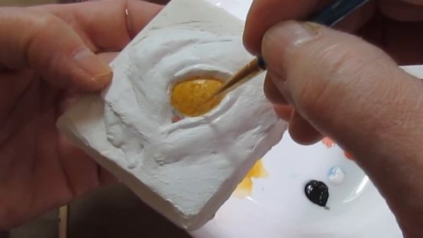 Painting Dog Eyes on Paper Mache Sculpture