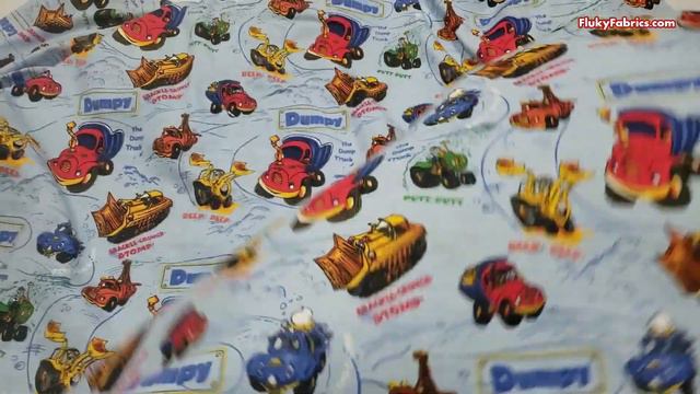 Cartoon Construction Trucks on Blue Cotton Rib Fabric смотреть онлайн