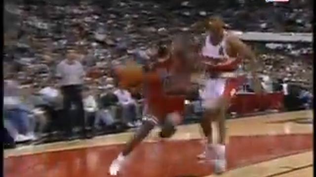 Dikembe Mutombo on his blocks