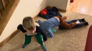 Three boys wrestling, every night before bed