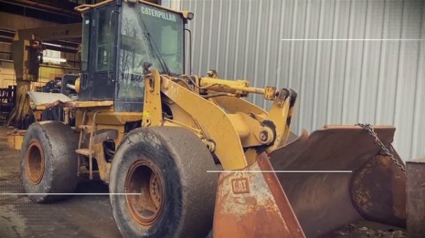 CAT 938G II Wheel Loader. Pushing A Non-Runner Into Teardown.