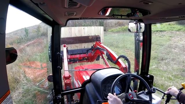 Negotiating a tractor tipping hazard with heavy weight on the loader смотреть онлайн