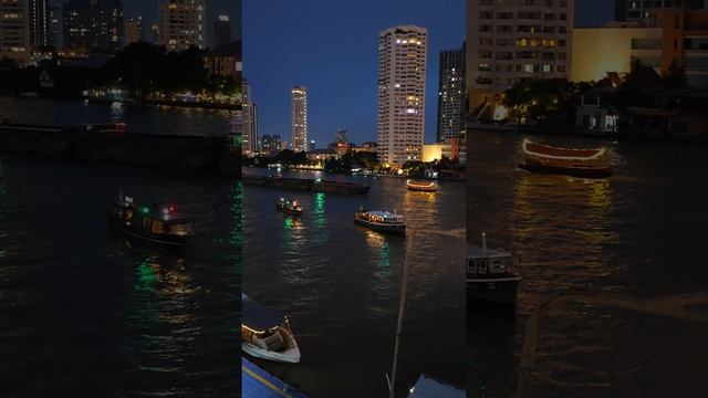 Движение лодок под мостом Таксин на реке Чаупхрая в Бангкоке смотреть онлайн