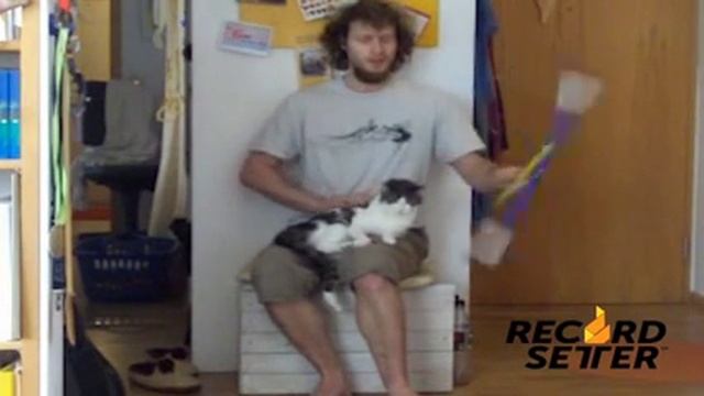 Longest Time Spinning Devil Stick While Petting Cat | RecordSetter.com смотреть онлайн