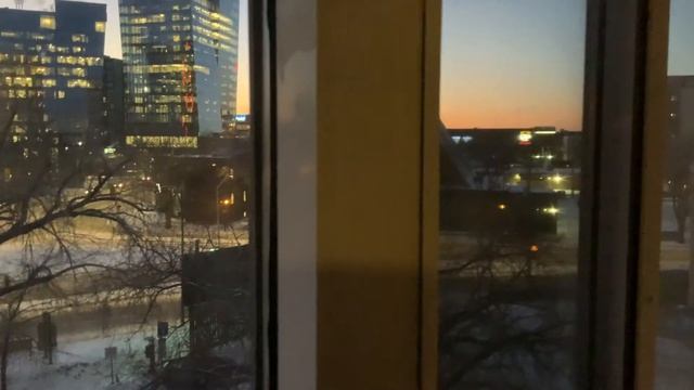 Beautiful Sunset from our Condo Apartment in Saskatoon. Merrilee on her laptop in the living room. смотреть онлайн
