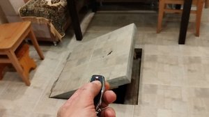 Механизм автоматического открывания люка подвала