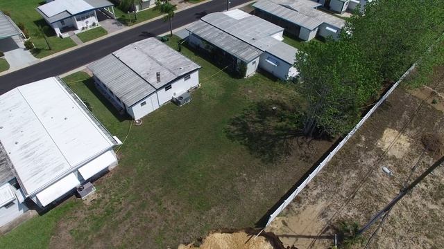 RAW VIDEO: Drone captures amazing view of massing sinkhole in Tarpon Springs смотреть онлайн