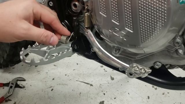 Installing footpegs on a modern KTM or Husqvarna motorcycle смотреть онлайн