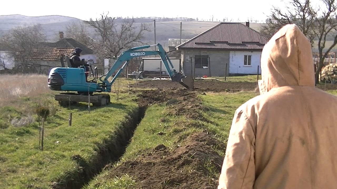 Засыпка траншеи.