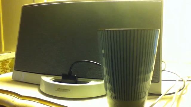 Smoke rising from tea in front of Bose iPod dock смотреть онлайн