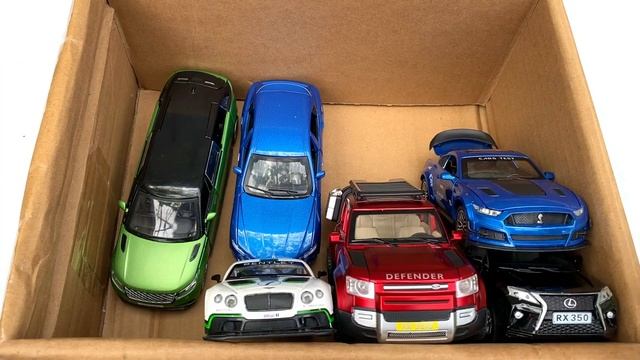 Box full of model Cars, Smart Fortwo, Jeep, Dodge Challenge, Defender, Tesla, Rolls Royce, RX300. смотреть онлайн