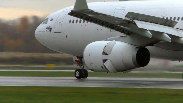 All-white I-Fly Airbus A330-200 Smooth Landing On A Slightly Wet Runway At LED.