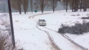 Isuzu Аxiom on sand with snow