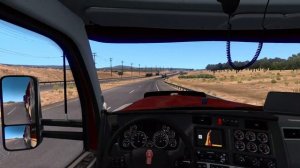 Kenworth W990 ATS Transporting Harvester