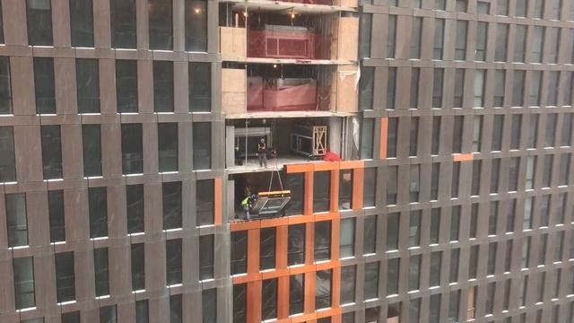 High-Rise Window Installation During Snowstorm смотреть онлайн