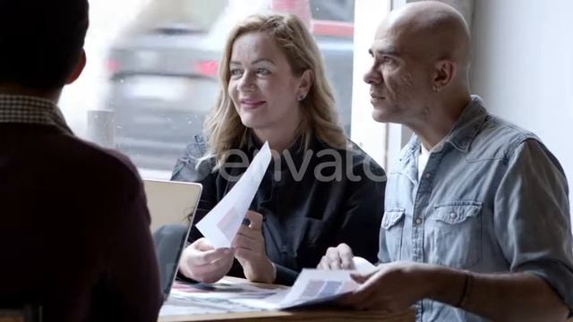 Serious Designers Working While Sitting at Table Near Window | Stock Footage - Envato elements смотреть онлайн