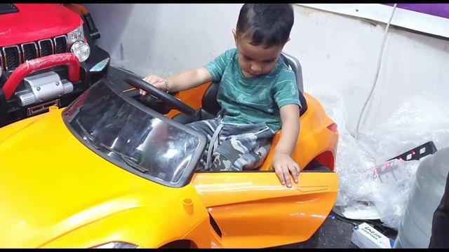 One YEAR OLD BOY FIRST TIME RIDING ELECTRIC CARS IN TOY SHOP SELECTING MODELS WHICH HE WANT смотреть онлайн