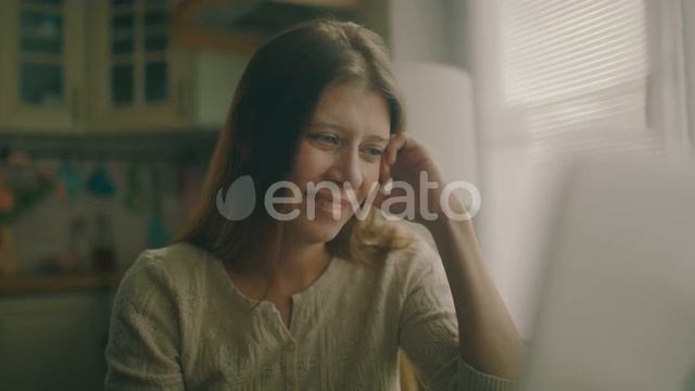 Woman Sitting At A Table Next To A Large Window At Home смотреть онлайн