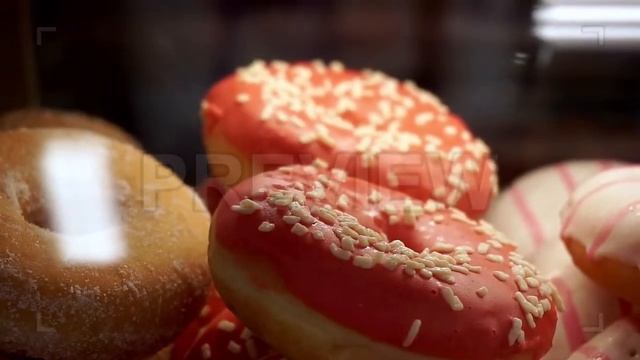 Delicious Donuts In Shop Window Stock Video смотреть онлайн