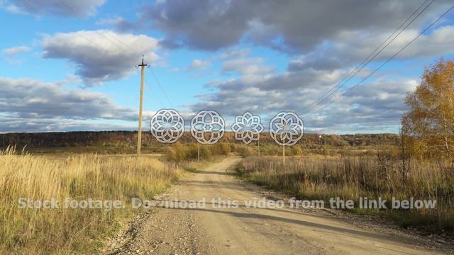 Autumn rural dirt road with pillars and wires. Landscape field on background autumn forest timelaps смотреть онлайн