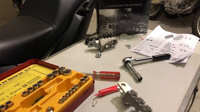Kawasaki Versys X 300 - How to install SW-Motech ion footrest/foot pegs смотреть онлайн