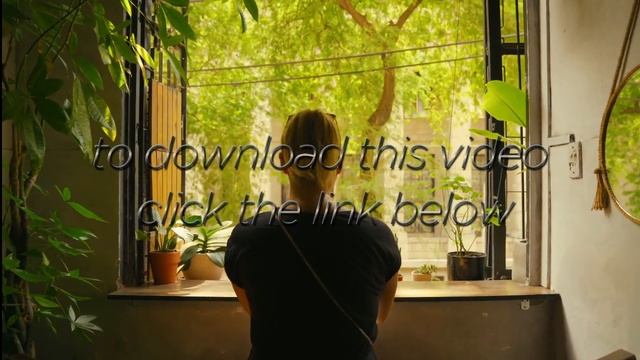 4K Walking Towards a Woman Looking out of a Window onto a Green Landscape смотреть онлайн
