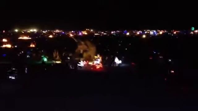 Night time city scape of Black Rock City from disco ball art car смотреть онлайн