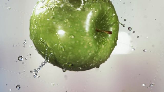 Flying of Green Apple in White Kitchen Background in Slow Motion смотреть онлайн