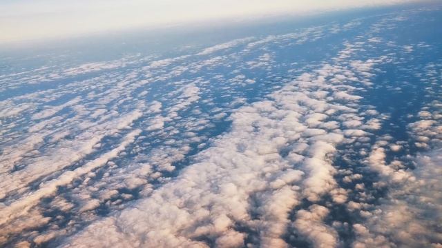 FLYING ACROSS EUROPE FROM AN AIRPLANE WINDOW. BLUE SKY. смотреть онлайн