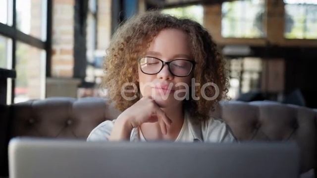 Girl in Glasses for Vision Looks Out Window While Working at Laptop | Stock Footage - Envato ele... смотреть онлайн