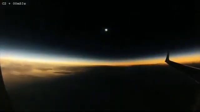 Watch from an airplane window as the moon's shadow moves over the Earth.. смотреть онлайн