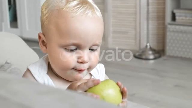 Sweet Blond-haired Baby Eating Green Apple | Stock Footage - Envato elements смотреть онлайн