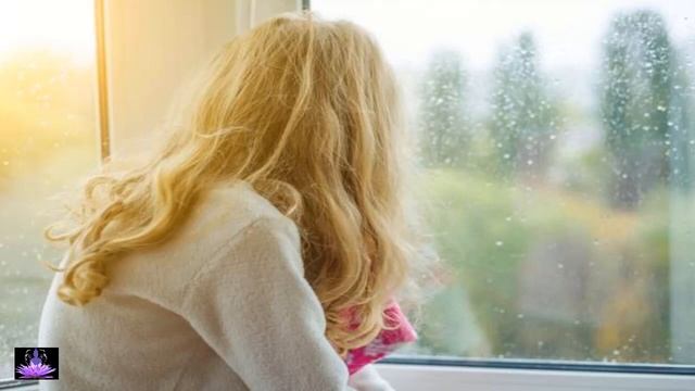 Lonely girl looking out of the window relaxing to the sound of falling rain and soft piano music. смотреть онлайн