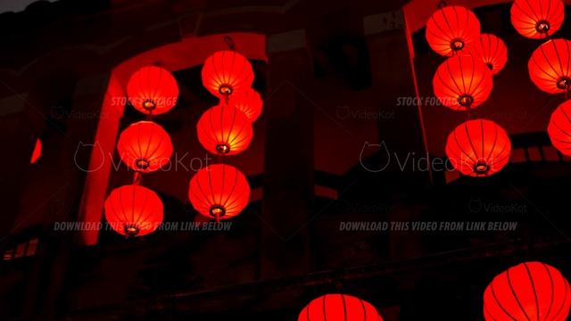 Red paper lanterns hanging on windows of building and shining at night смотреть онлайн