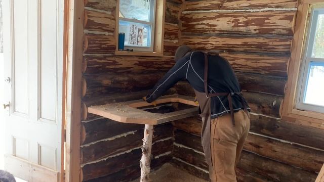 Back at the off grid log cabin. Installing the kitchen sink, drift wood shelf and a window sill. смотреть онлайн