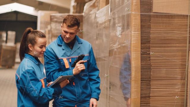 Managers scan a barcode at a packaging factory. Warehouse. QR code on pallets. смотреть онлайн