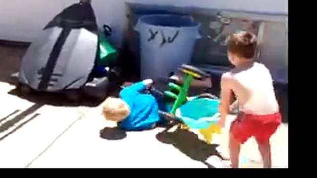 Kid runs into trash can on a trike смотреть онлайн