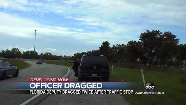 Video shows a driver dragging an officer with his car in Florida смотреть онлайн