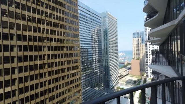 Tour a large one-bedroom at the iconic Aqua apartment tower смотреть онлайн