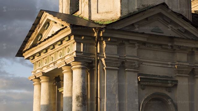 Side view of an ancient church wall. Stock footage. Windows and white walls of the old church or смотреть онлайн