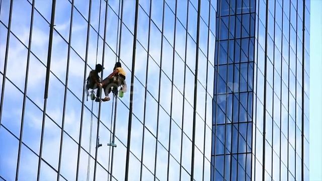 Man Cleaning Windows of Office Building VideoHive Stock Footage смотреть онлайн