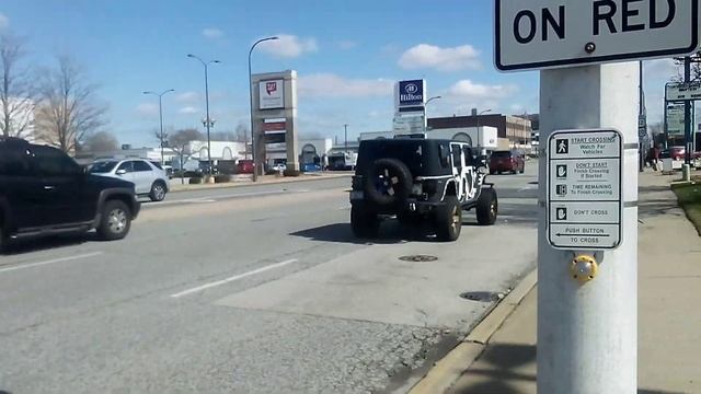 This Jeep Wrangler has a set of custom rims and a custom wrap. смотреть онлайн