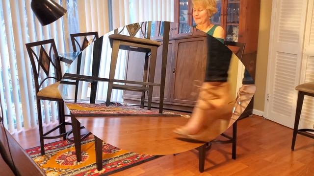 DRESSING UP A PAIR OF JEANS WITH 3 PAIRS OF STILETTO HEELS .