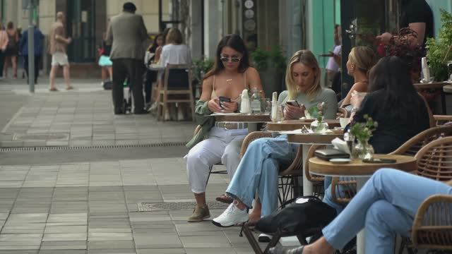 Beautiful Stylish Girls And Young People Are Relaxing In The Famous Place.