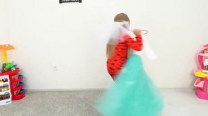 Lera as a bride puts on a wedding dress