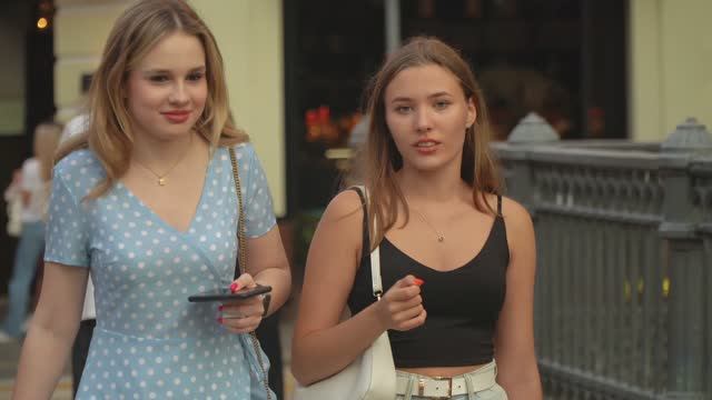 Beautiful Stylish Girls And Young People Are Relaxing In The Famous Place Of Moscow.