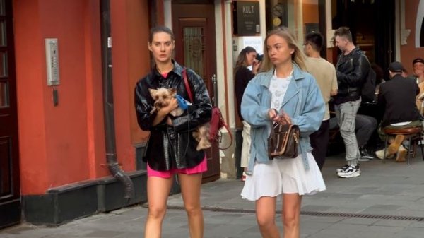 Walk along the historical street of Moscow. Model girls posing for street photographers. Past II.
