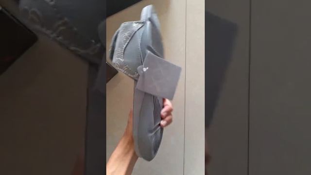 KAWS x Air Jordan 4 Cool Grey Slipper 930155-003 смотреть онлайн