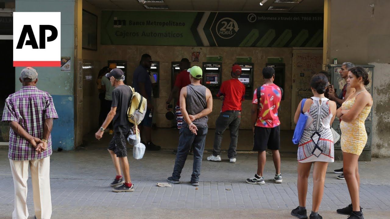 Cuba's cash shortage causes long lines at banks and ATMs смотреть онлайн